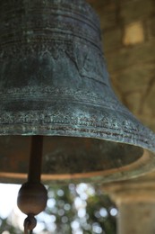 Closeup view of large old bell in tower