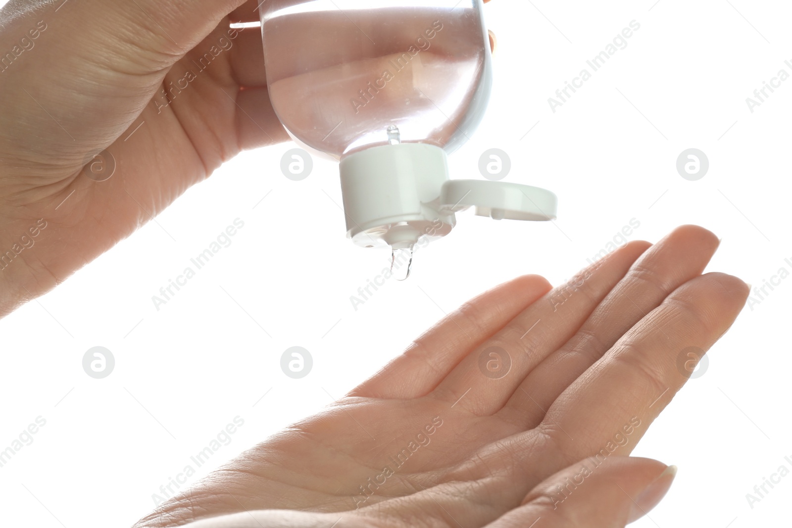 Photo of Woman applying antibacterial hand gel against white background, closeup