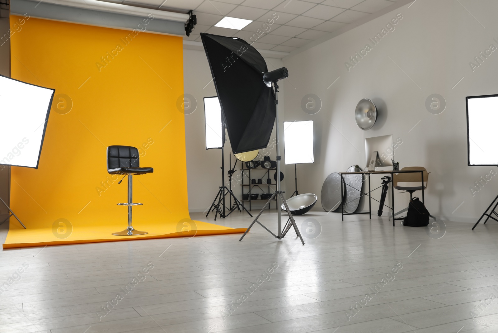 Photo of Interior of modern photo studio with professional equipment