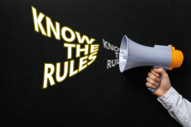 Image of Man using megaphone to say Know the rules, closeup