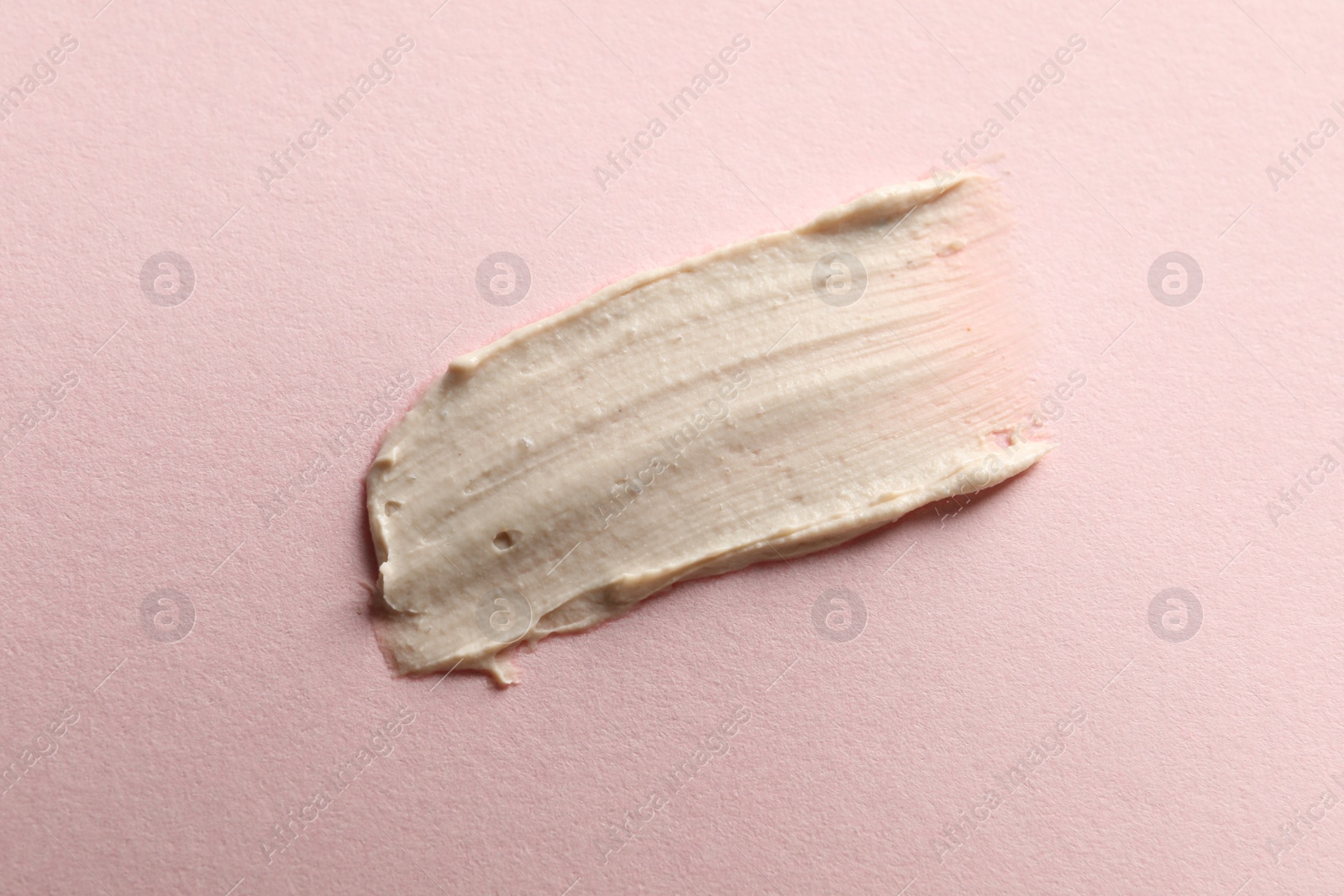 Photo of Sample of face mask on pink background, top view