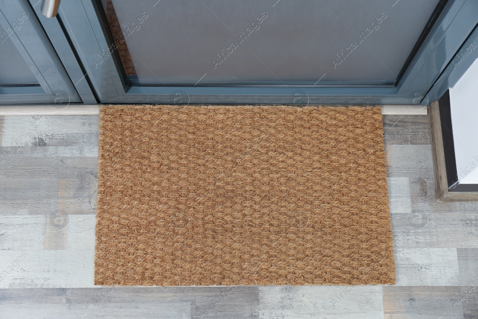 Photo of New clean mat near entrance door, top view