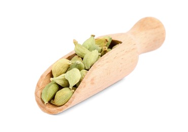 Photo of Wooden scoop with dry cardamom pods isolated on white