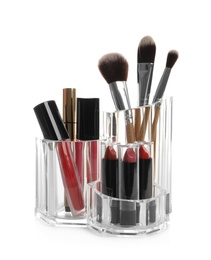 Photo of Lipstick holder with different makeup products on white background