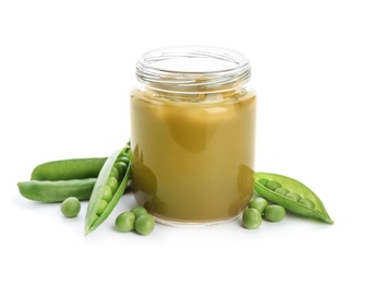 Jar with healthy baby food and green peas on white background