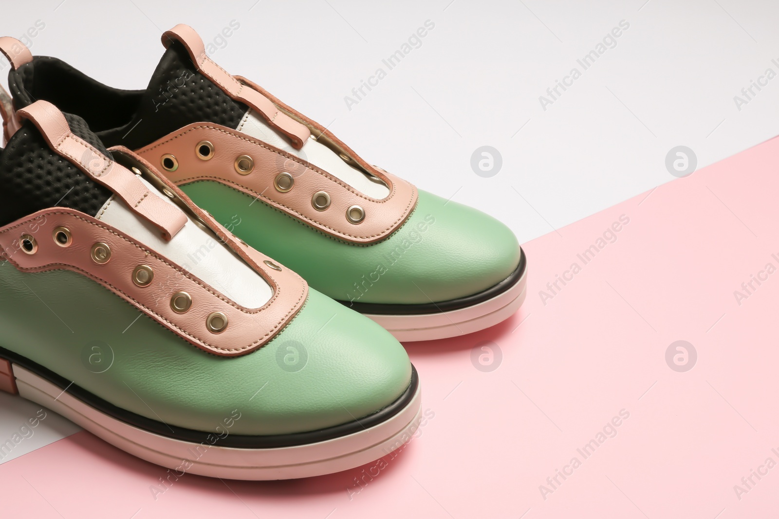 Photo of Stylish shoes on color background, space for text