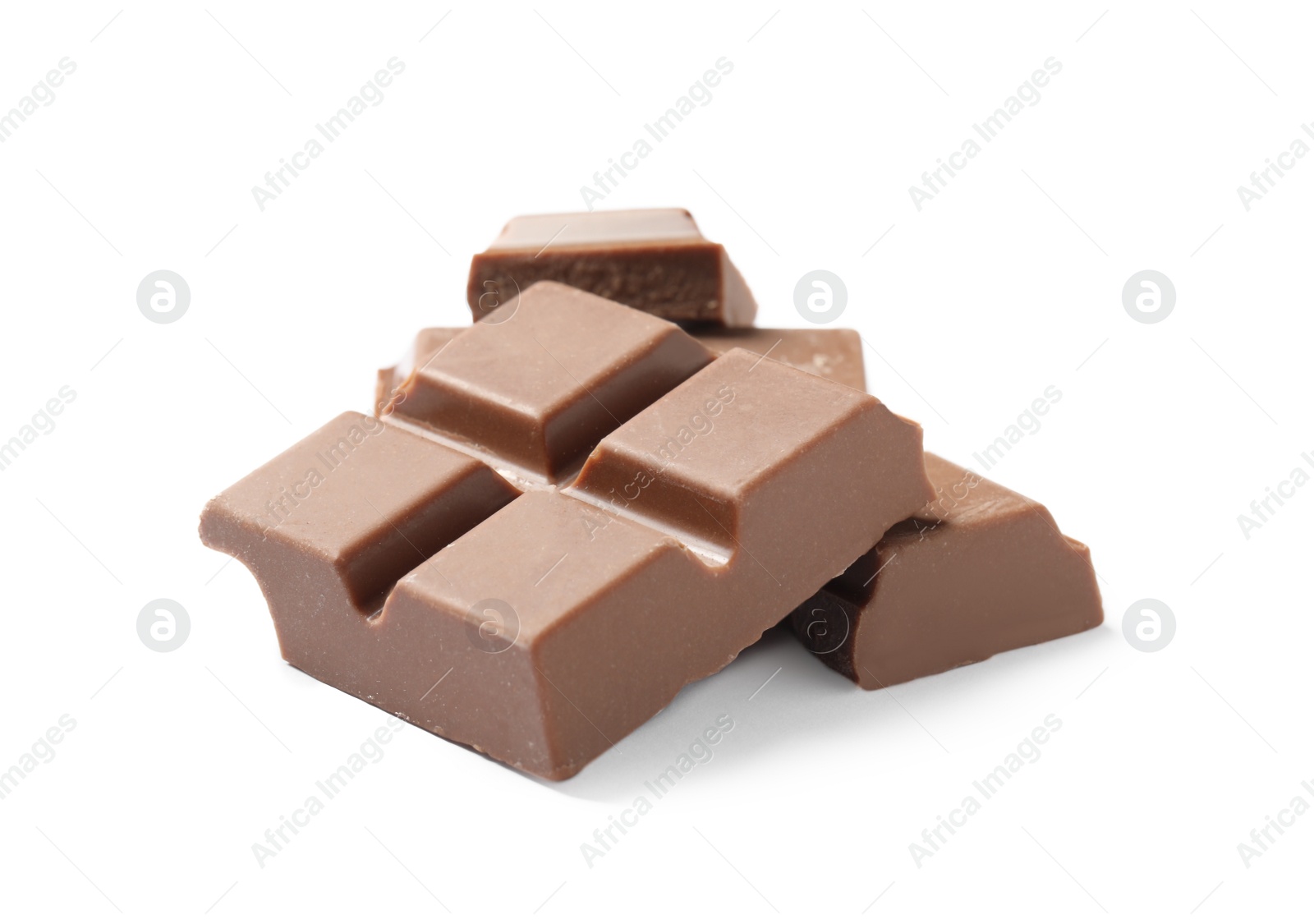 Photo of Pieces of delicious milk chocolate isolated on white