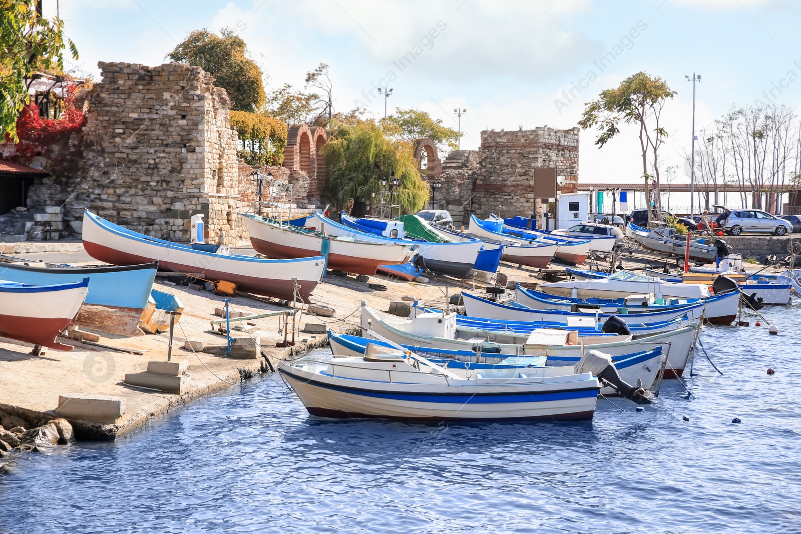 Photo of Picturesque view of port with moored boats on sunny day