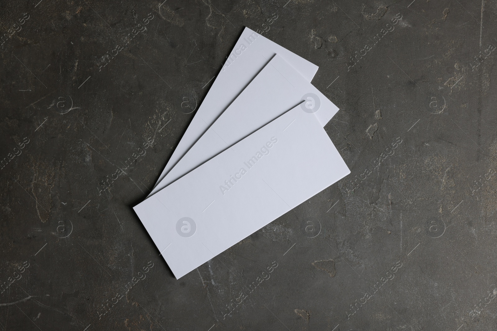 Photo of Blank business cards on grey textured background, top view. Mockup for design