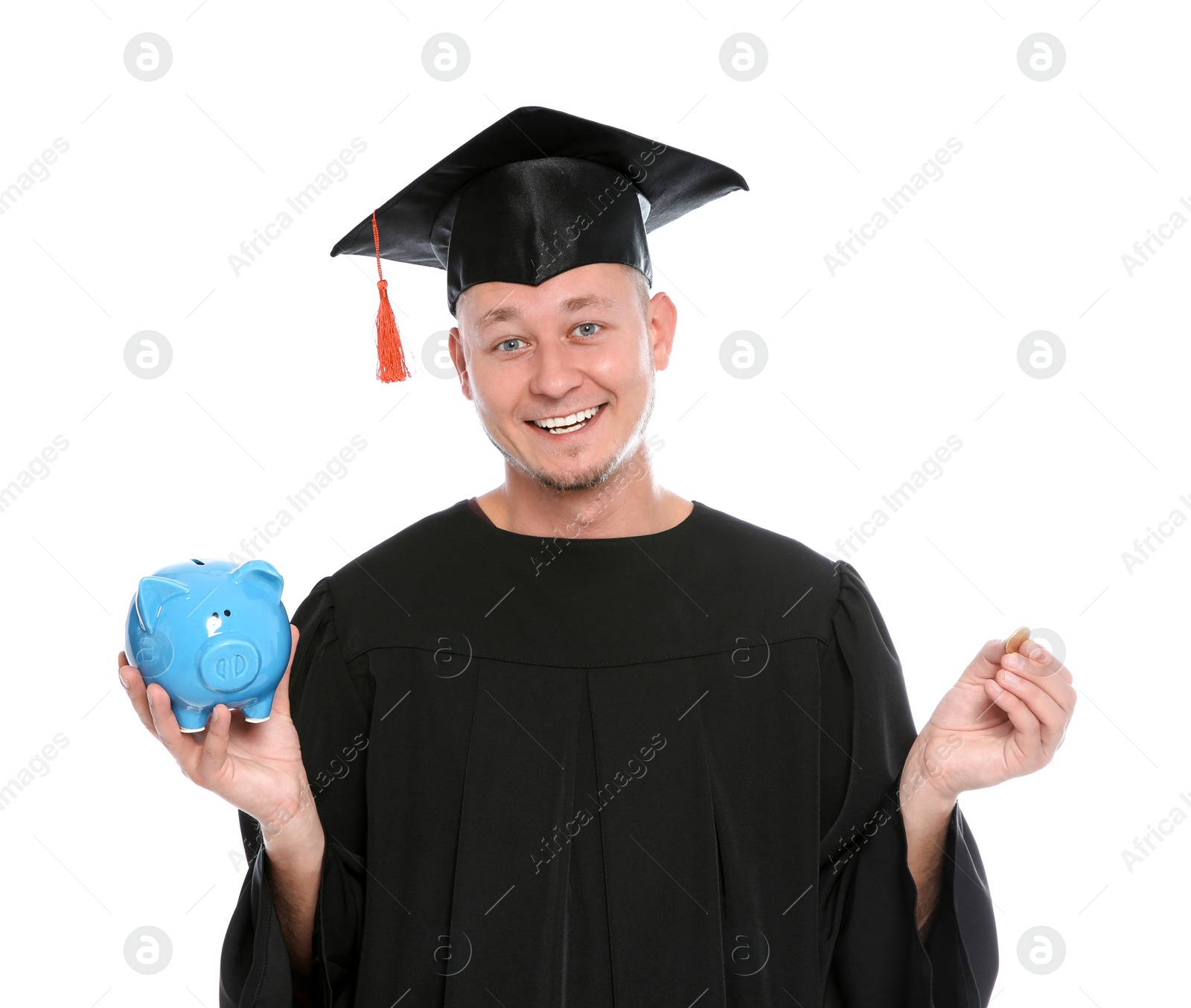 Photo of Portrait of young graduate with piggy bank and coin on white background