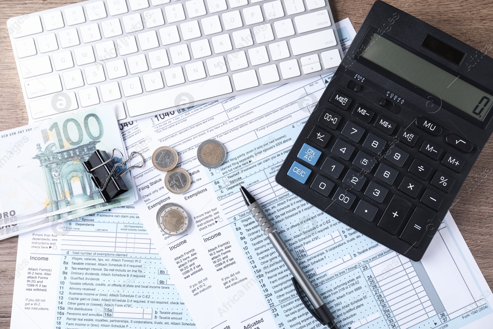 Photo of Tax accounting. Flat lay composition with calculator and documents on wooden table