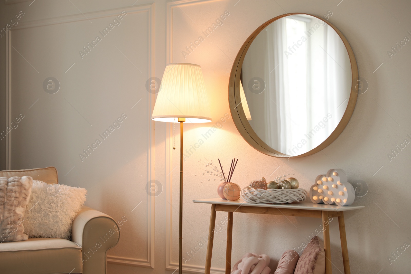 Photo of Beautiful room interior with round mirror and Christmas decor