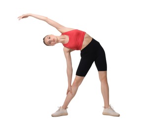 Photo of Yoga workout. Young woman stretching on white background