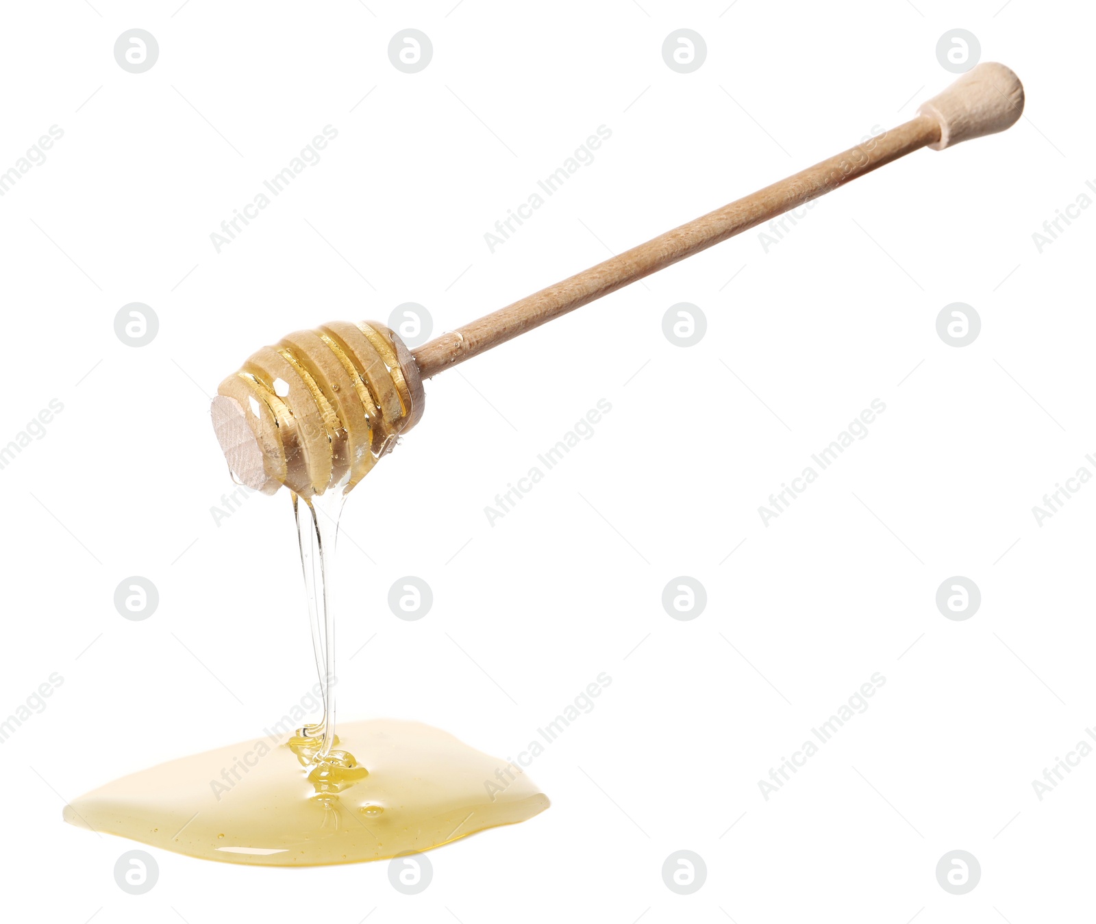 Photo of Natural honey dripping from dipper on white background