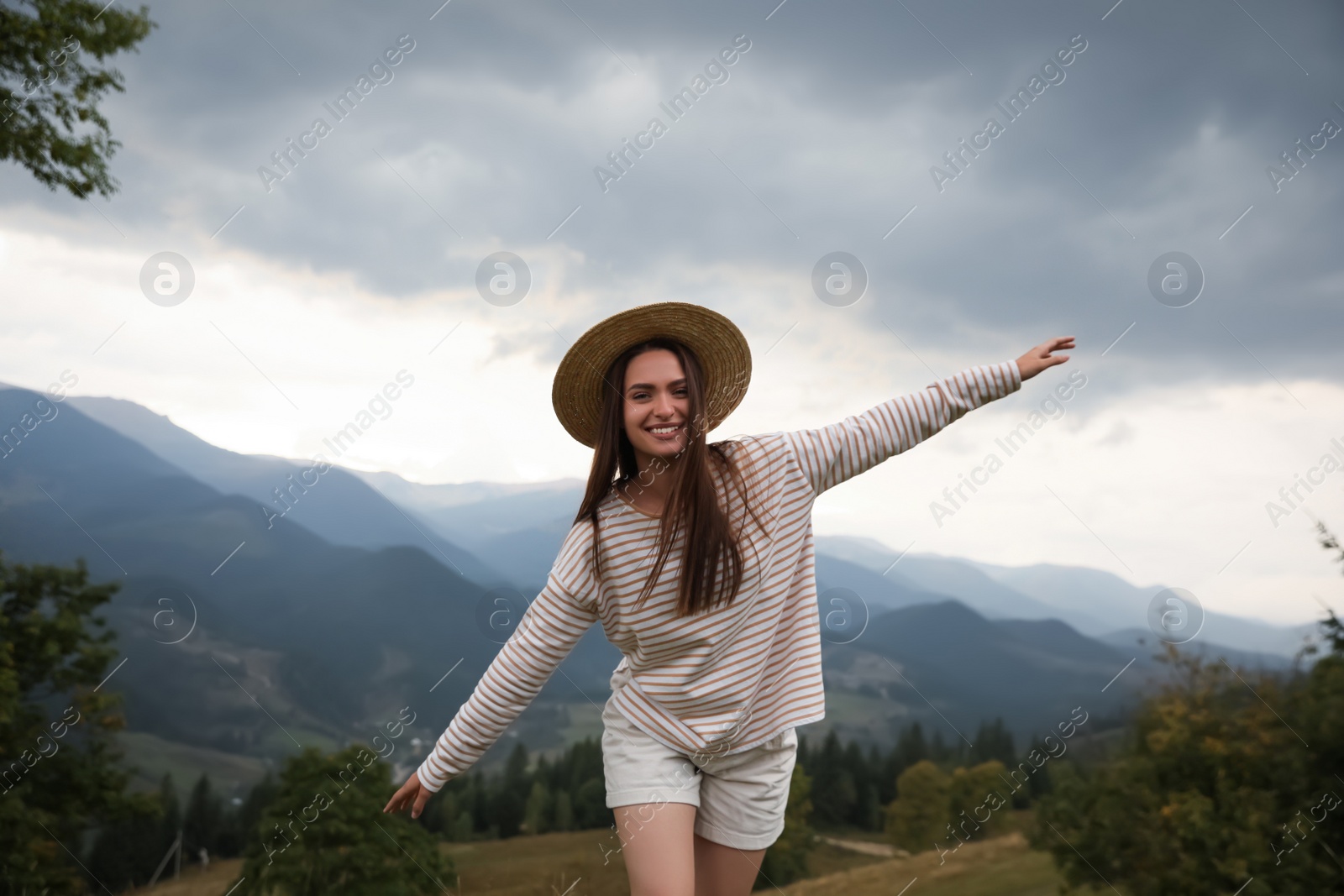 Photo of Young woman enjoying her time in mountains