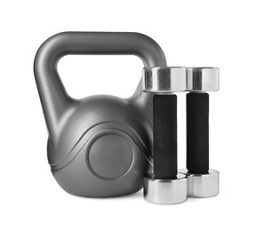 Photo of Dumbbells and kettlebell isolated on white. Sports equipment