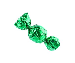 Photo of Tasty candy in green wrapper isolated on white