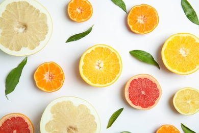 Photo of Different citrus fruits on white background, flat lay