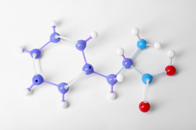 Photo of Molecule of phenylalanine on white background, top view. Chemical model