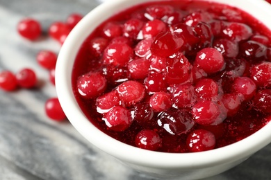 Delicious fresh cranberry sauce in bowl, closeup