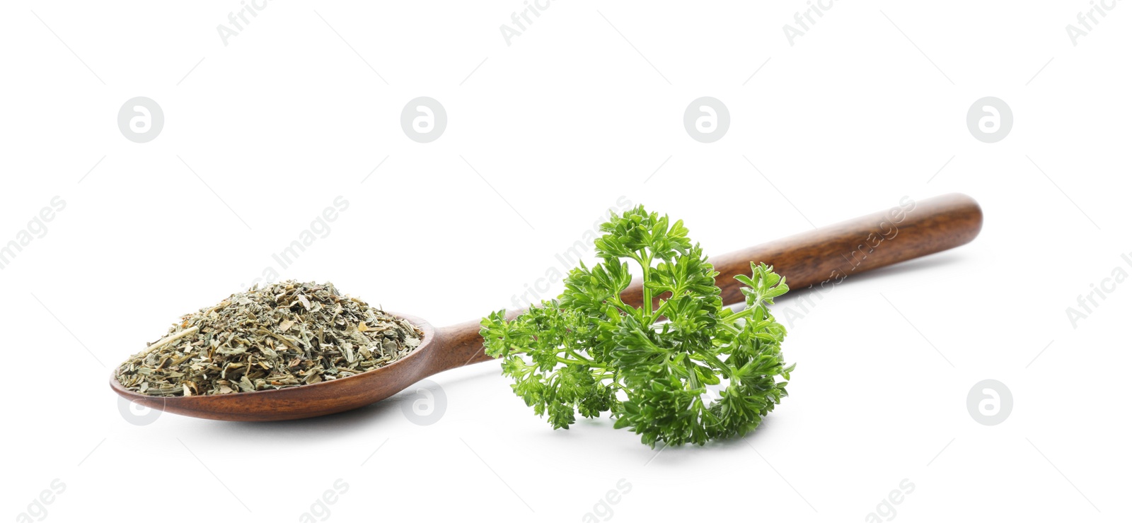 Photo of Wooden spoon with dried parsley on white background