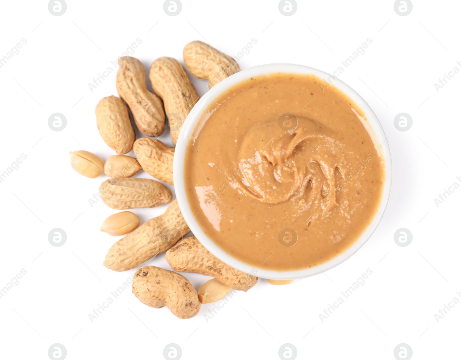 Photo of Delicious nut butter and peanuts isolated on white, top view