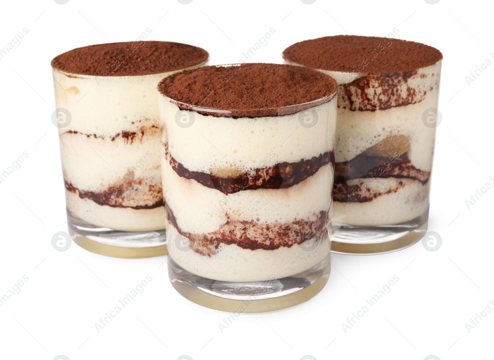 Photo of Delicious tiramisu in glasses isolated on white