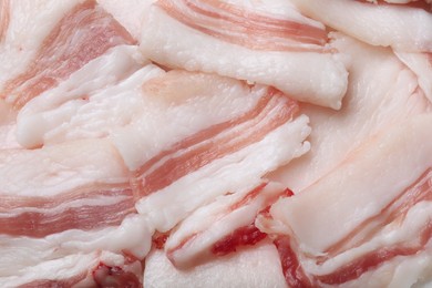 Photo of Slices of tasty salt pork as background, top view