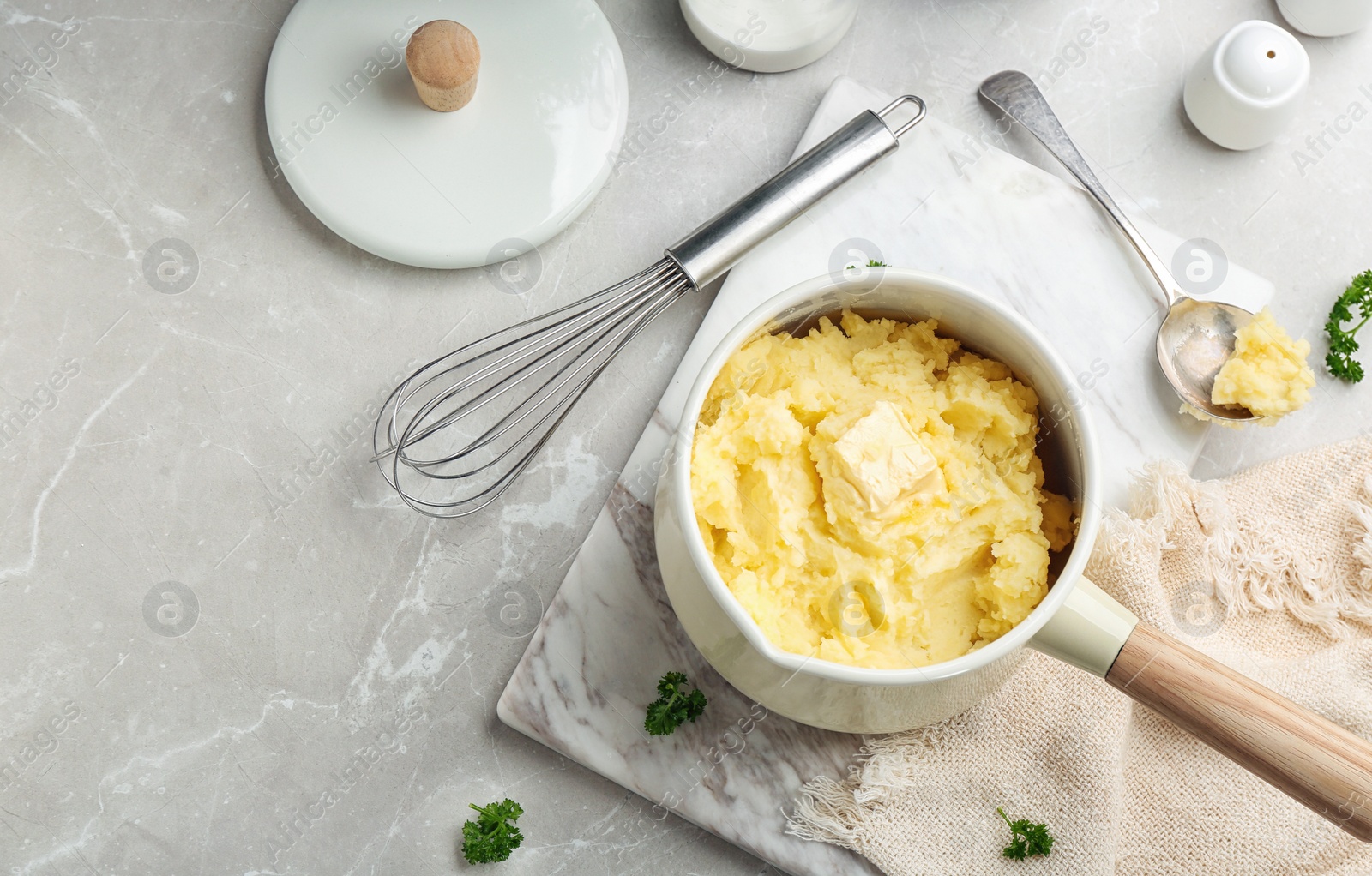 Photo of Flat lay composition with tasty mashed potato on gray table