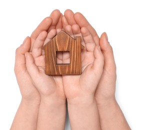 Photo of Home security concept. Woman with her little child holding house model on white background, top view