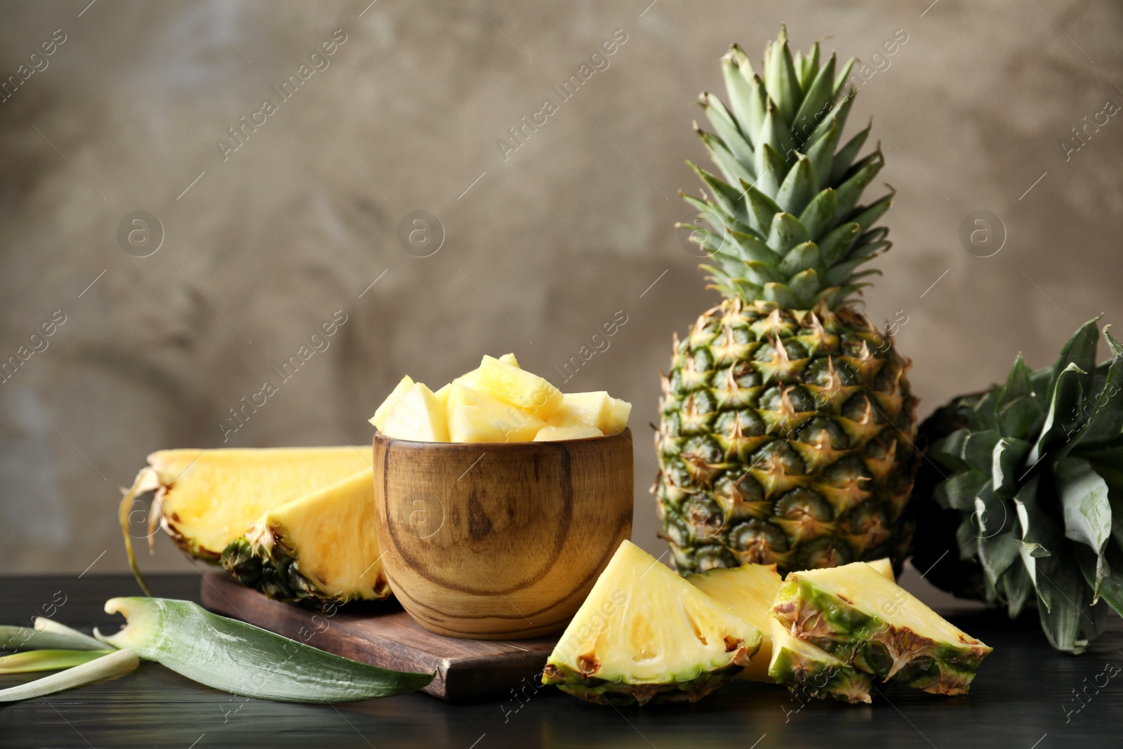 Photo of Composition with fresh sliced pineapple on table