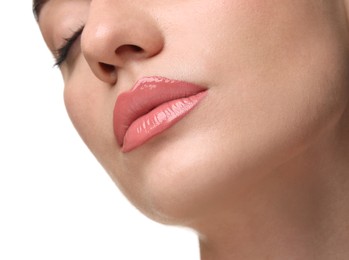 Photo of Woman wearing beautiful lip gloss on white background, closeup