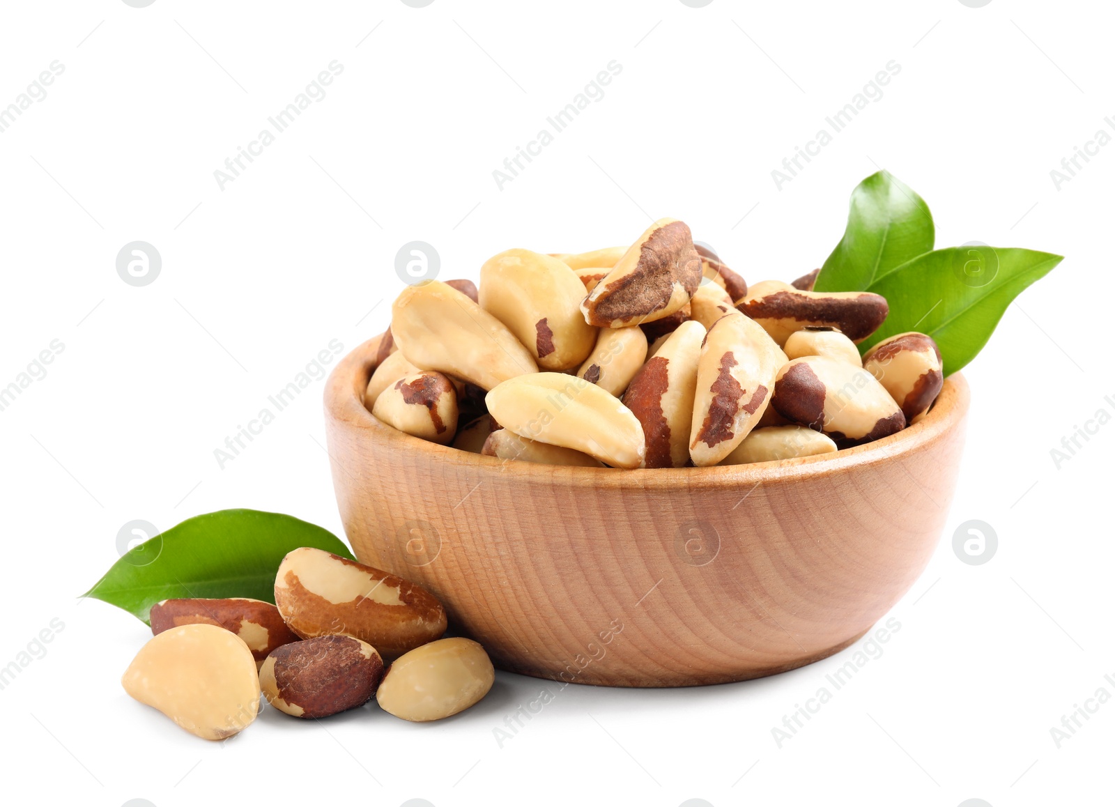 Photo of Brazil nuts in wooden bowl on white background