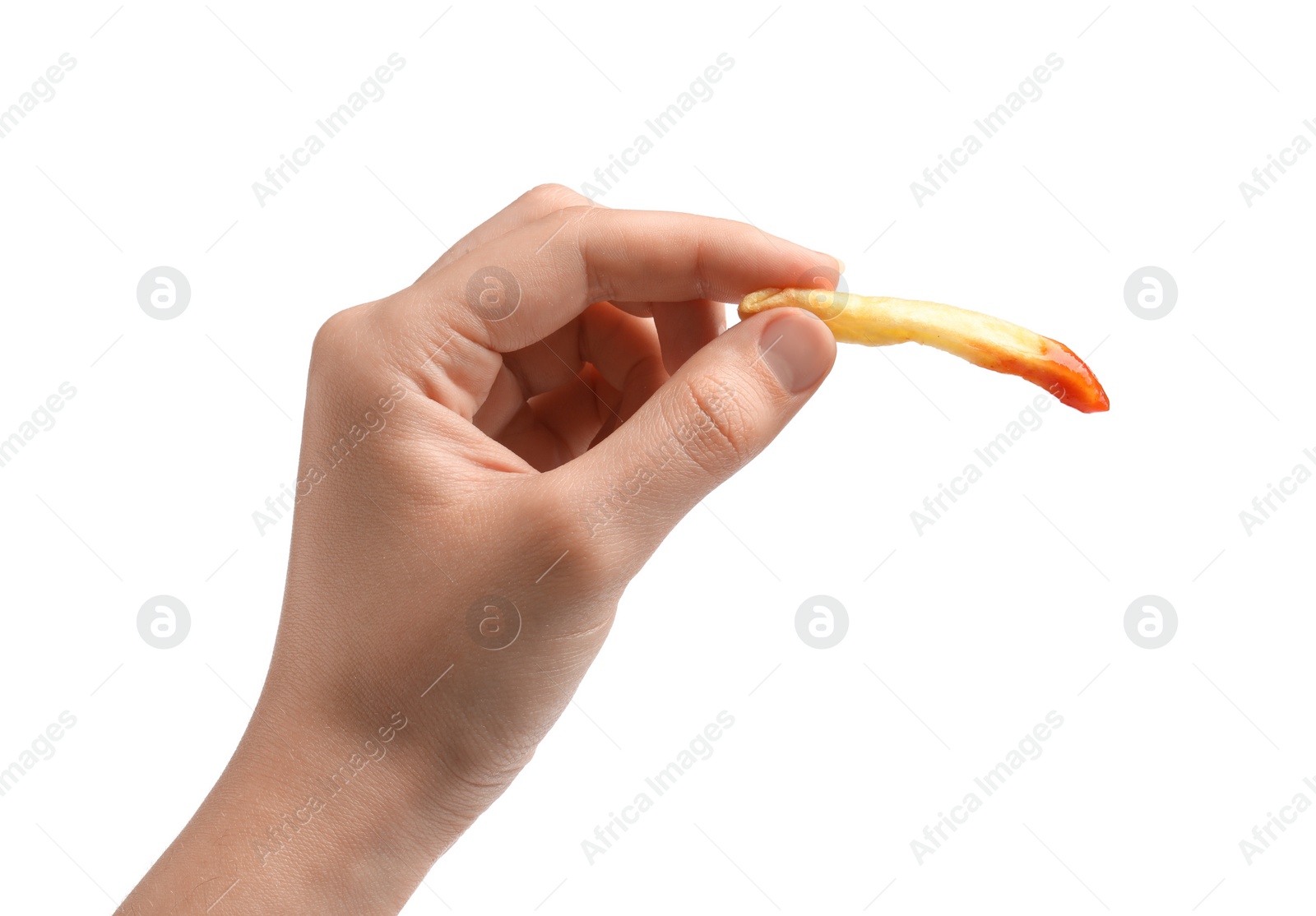 Photo of Woman holding delicious french fry with ketchup on white background, closeup