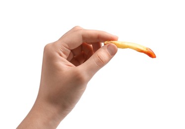 Woman holding delicious french fry with ketchup on white background, closeup