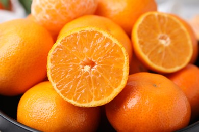 Photo of Bowl of fresh juicy tangerines, closeup view