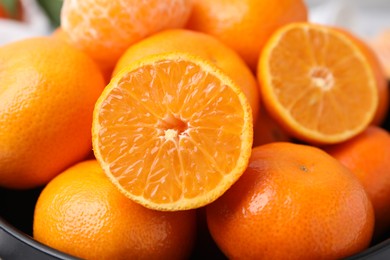 Bowl of fresh juicy tangerines, closeup view