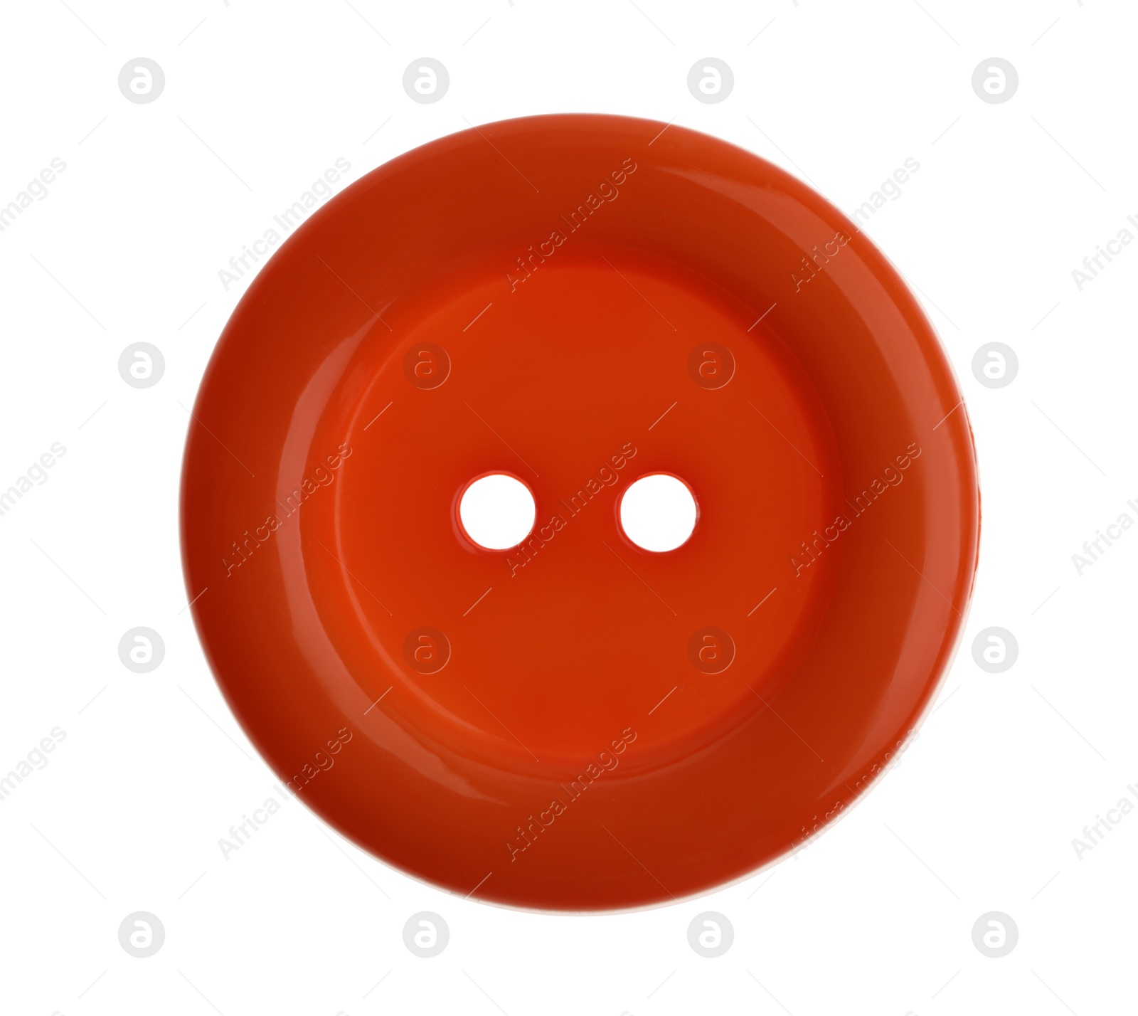 Photo of Orange plastic sewing button isolated on white