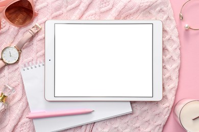 Photo of Flat lay composition with modern tablet on pink background. Space for text