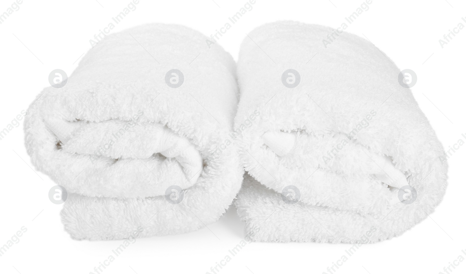Photo of Two rolled terry towels isolated on white