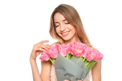 Photo of Portrait of smiling young girl with beautiful tulips on white background. International Women's Day