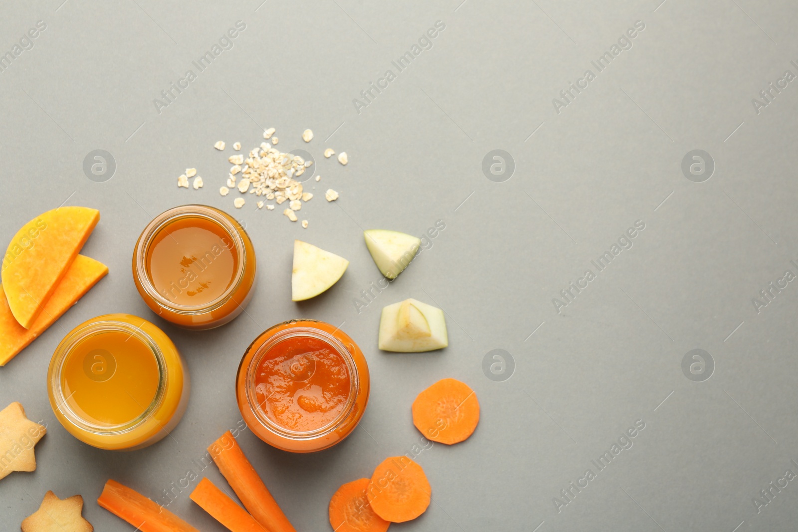 Photo of Flat lay composition with healthy baby food on grey background. Space for text
