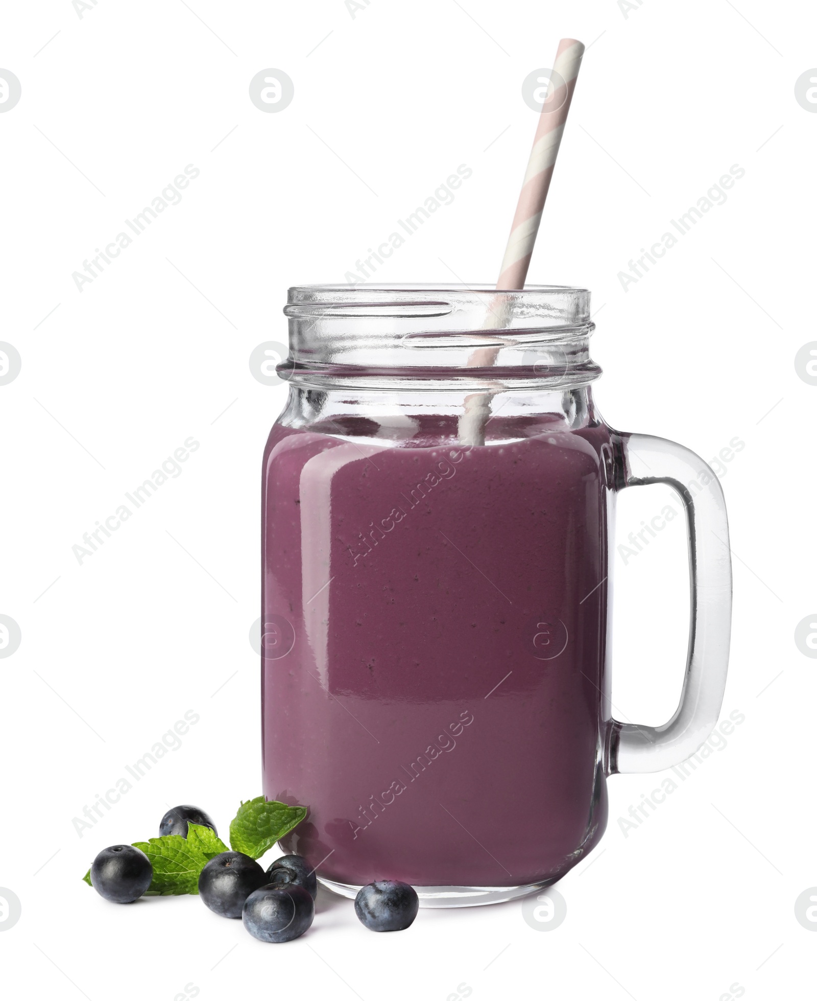 Photo of Mason jar of acai drink with berries on white background