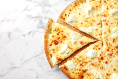 Delicious cheese pizza on marble background, top view