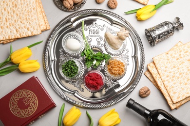 Photo of Flat lay composition with symbolic Passover (Pesach) items on color background