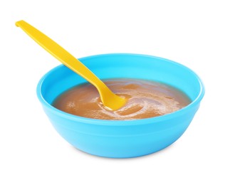 Tasty baby food and spoon in bowl isolated on white