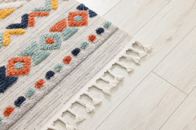 Photo of Carpet with beautiful pattern on floor, space for text