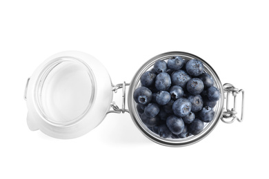 Photo of Fresh tasty blueberries in glass jar isolated on white, top view