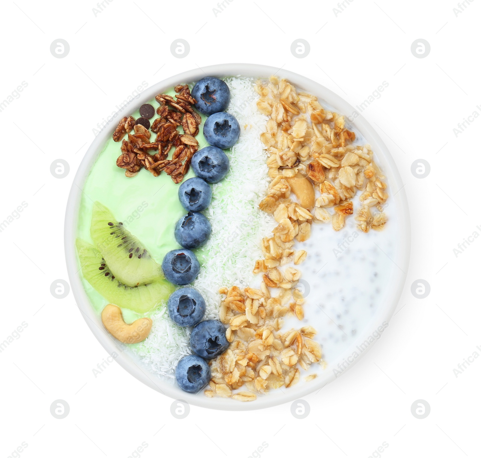 Photo of Tasty smoothie bowl with fresh kiwi fruit, blueberries and oatmeal isolated on white, top view