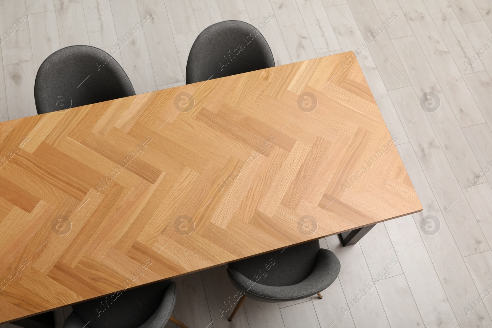 Photo of Wooden table and grey chairs indoors, above view